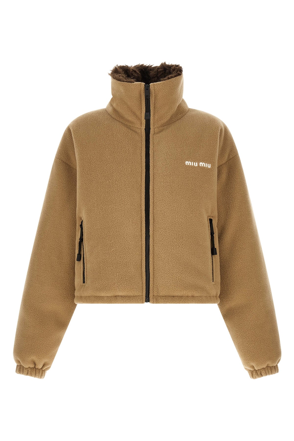 miu miu short down jacket redefines volumes through a compact and structured sil