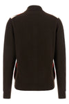the miu miu cardigan redefines the codes of classic knitwear through a structure