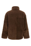 the brunello cucinelli reversible jacket in pure fuzzy lamb shearling stands o