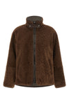 the brunello cucinelli reversible jacket in pure fuzzy lamb shearling stands o