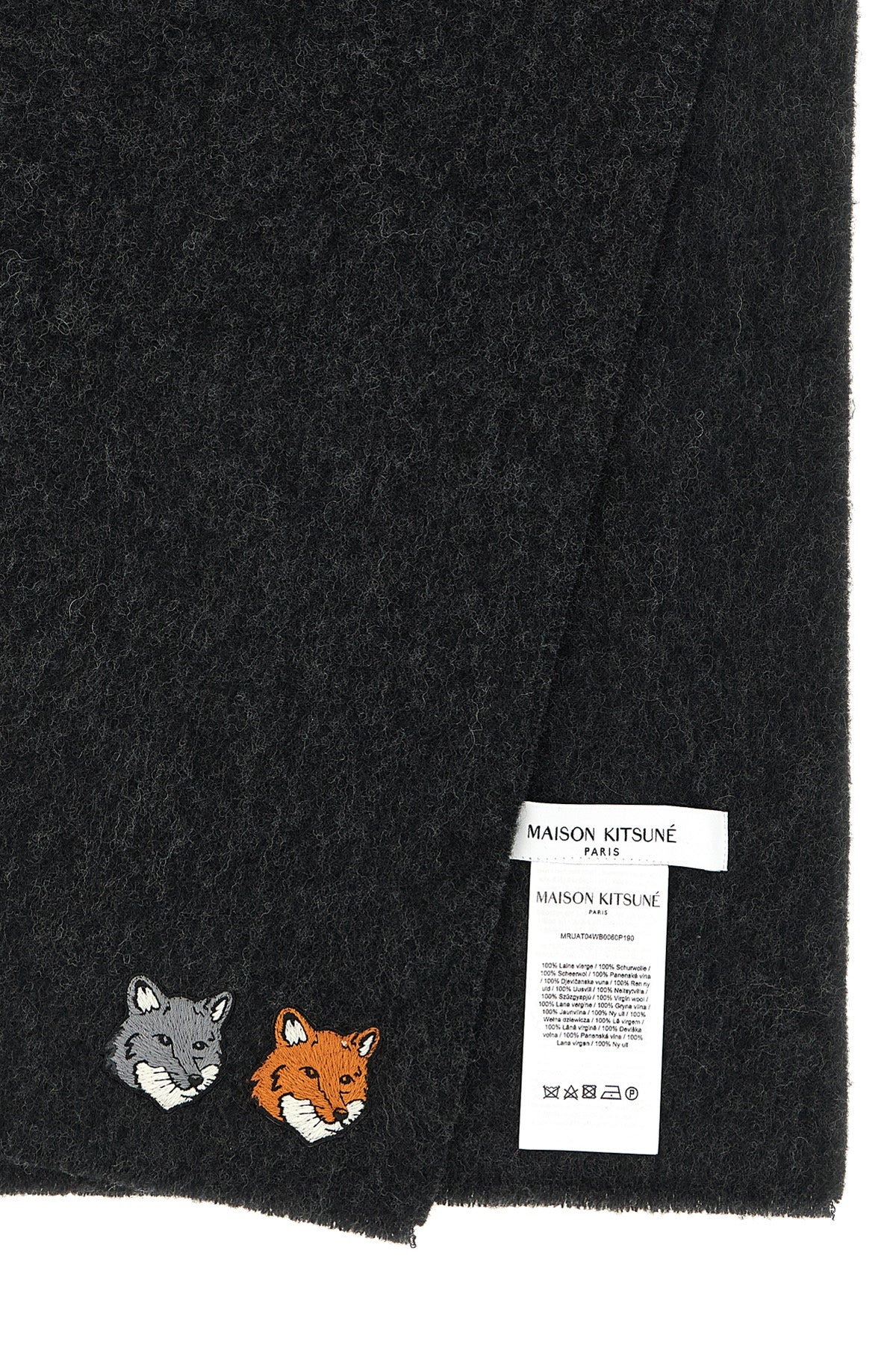 the maison kitsuné scarf redefines everyday elegance through an essential silhou