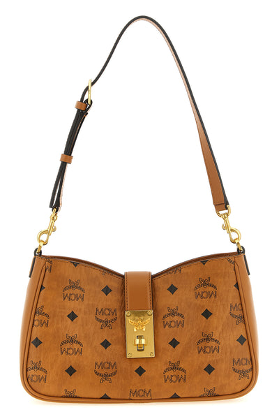 the mcm tracy shoulder bag defines a structured aesthetic through its iconic c