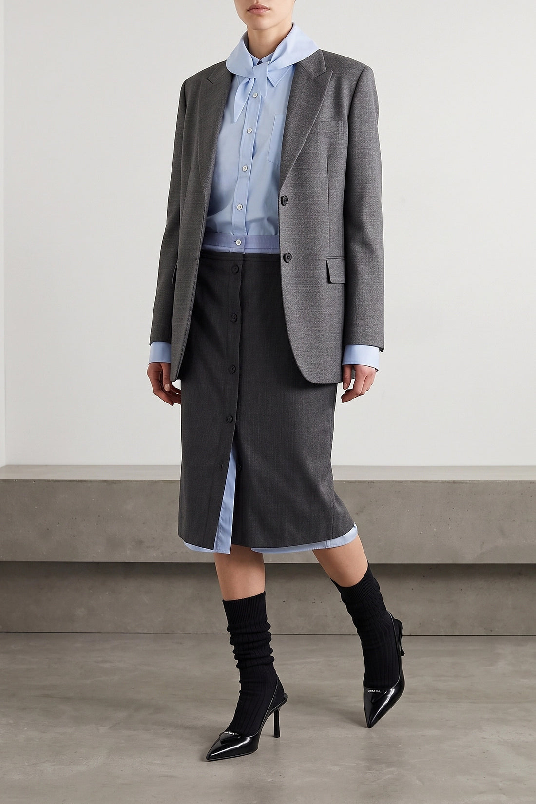 PRADA 38 the prada midi skirt in a fine virgin wool and mohair blend is distinguished by