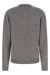 the prada sweater reinterprets the classic codes of knitwear through a pure cash