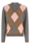 the prada sweater reinterprets the classic codes of knitwear through a pure cash