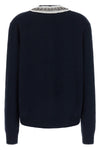 the prada cardigan in fine navy blue yarn embodies timeless elegance through une