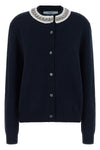 the prada cardigan in fine navy blue yarn embodies timeless elegance through une