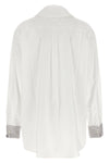 the prada poplin shirt redefines classic tailoring through unexpected details an