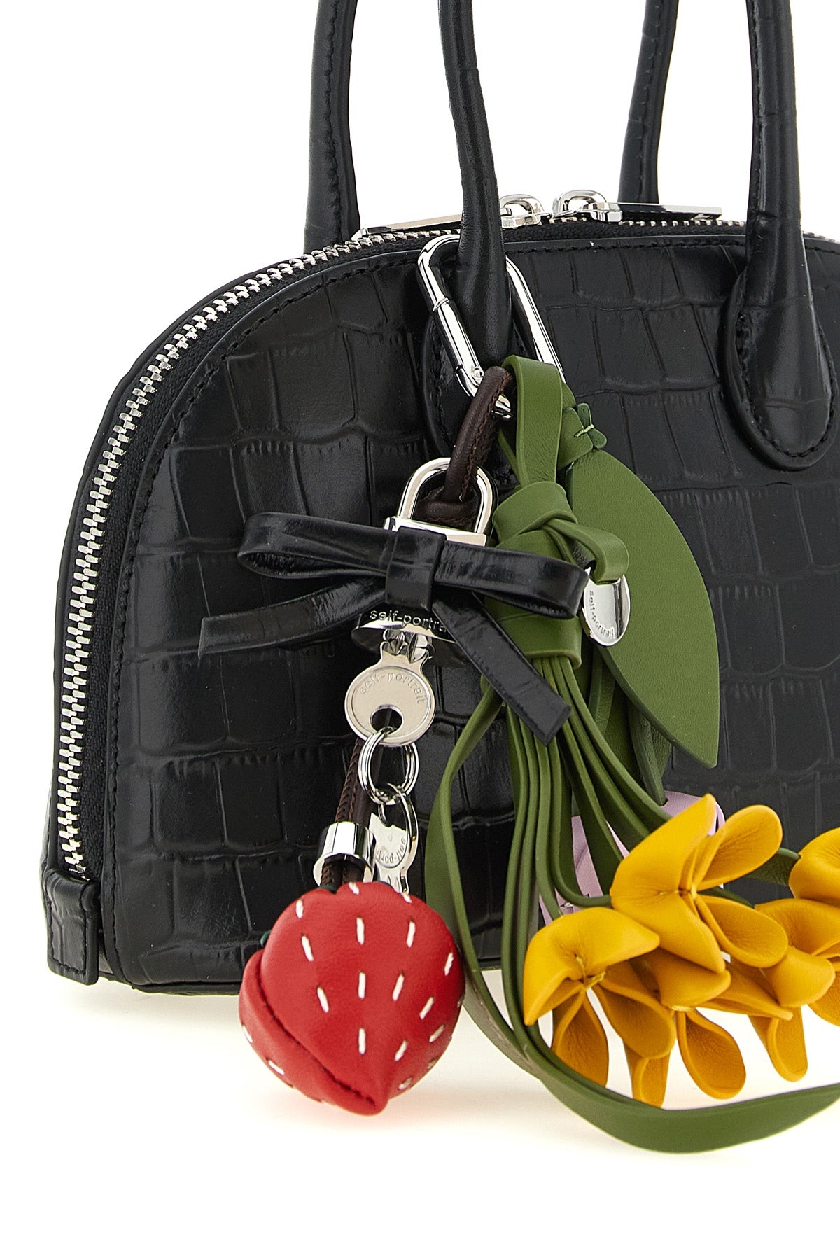 the self-portrait mini bag defines a new elegance through a structured dome silh