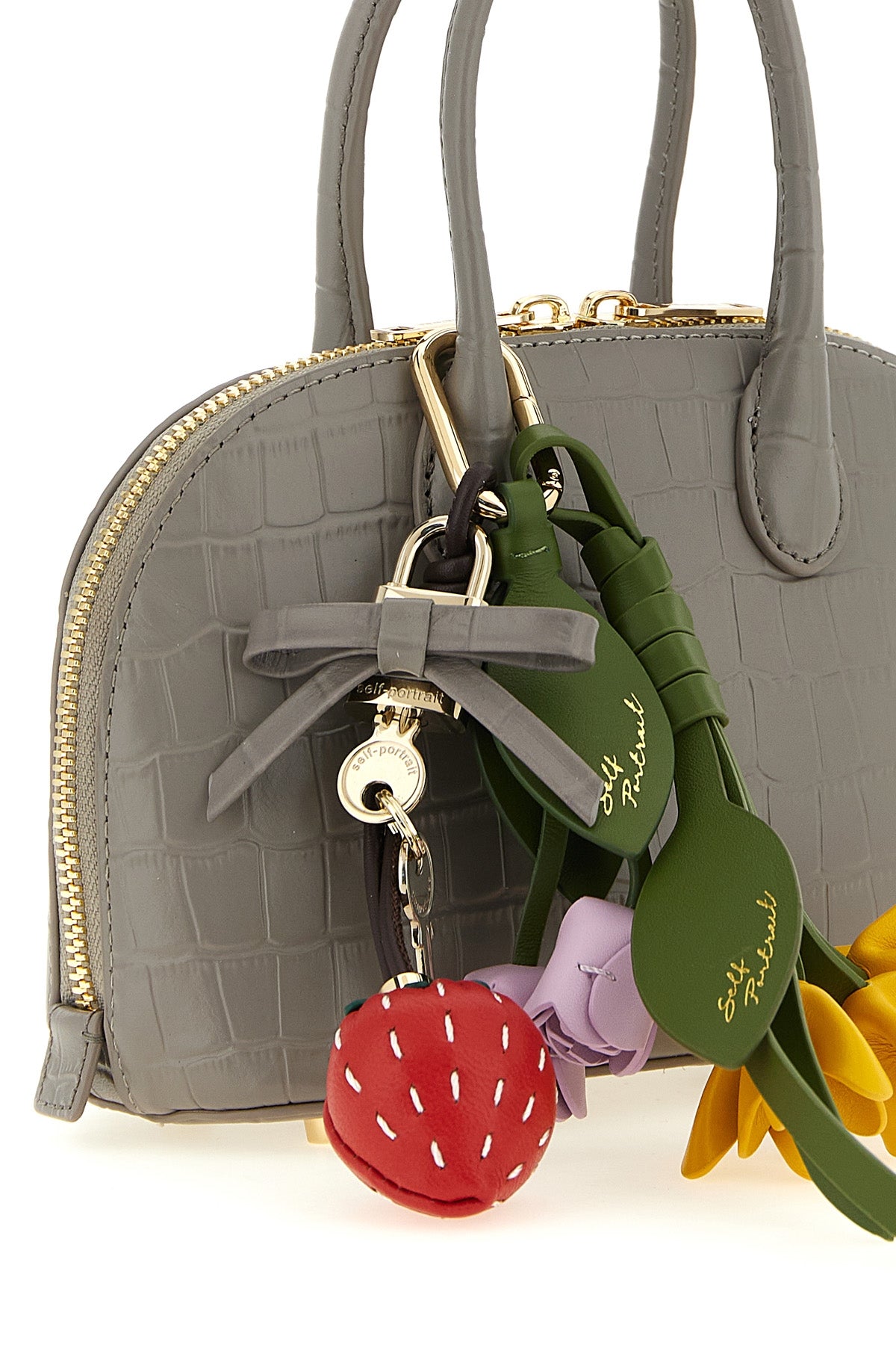 the self-portrait croc leather toast handbag features a structured silhouette ma