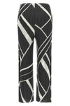 the fold line pleats please pants redefine the silhouette through a rigorous a