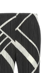 the fold line pleats please pants redefine the silhouette through a rigorous a