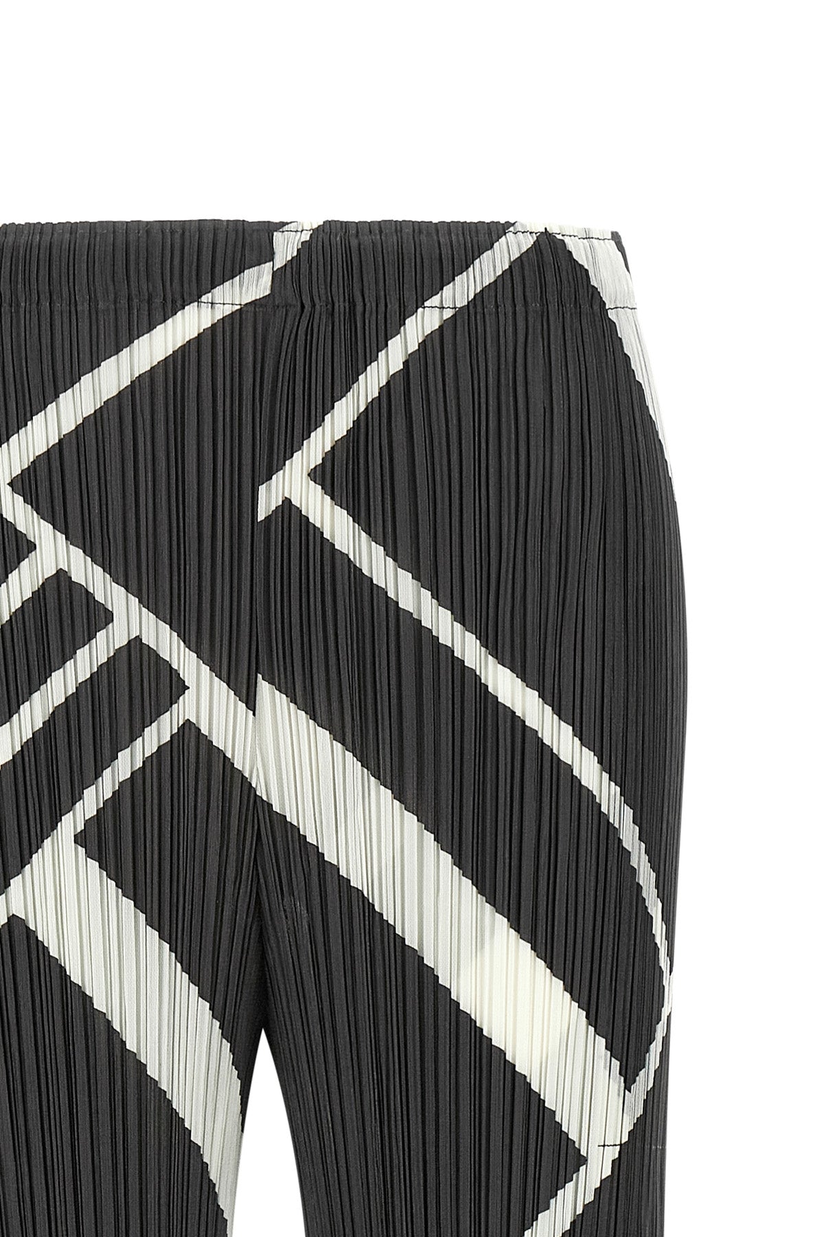 the fold line pleats please pants redefine the silhouette through a rigorous a