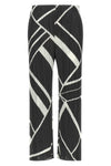the fold line pleats please pants redefine the silhouette through a rigorous a