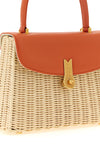 the daniele amato queen rattan handbag defines a structured aesthetic through th