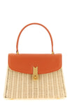 the daniele amato queen rattan handbag defines a structured aesthetic through th
