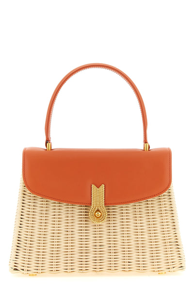 the daniele amato queen rattan handbag defines a structured aesthetic through th