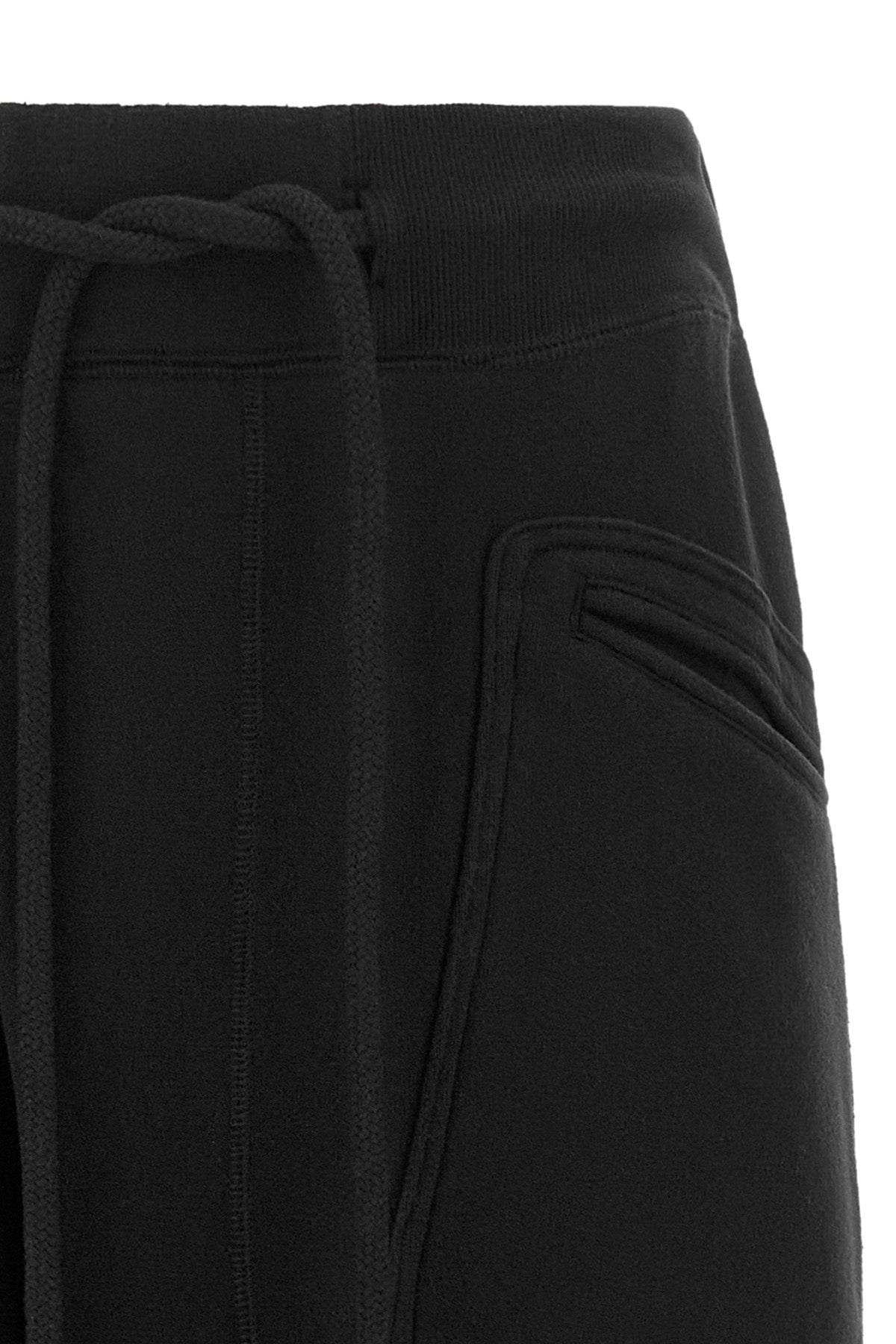 the r13 tracksuit pants redefine loungewear through bold proportions and a decon