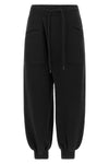 the r13 tracksuit pants redefine loungewear through bold proportions and a decon