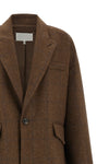 the maison margiela oversized cocooning coat redefines the proportions of the ou