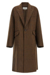 the maison margiela oversized cocooning coat redefines the proportions of the ou