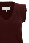 the maison margiela vest redefines the codes of knitwear through a lived and dec