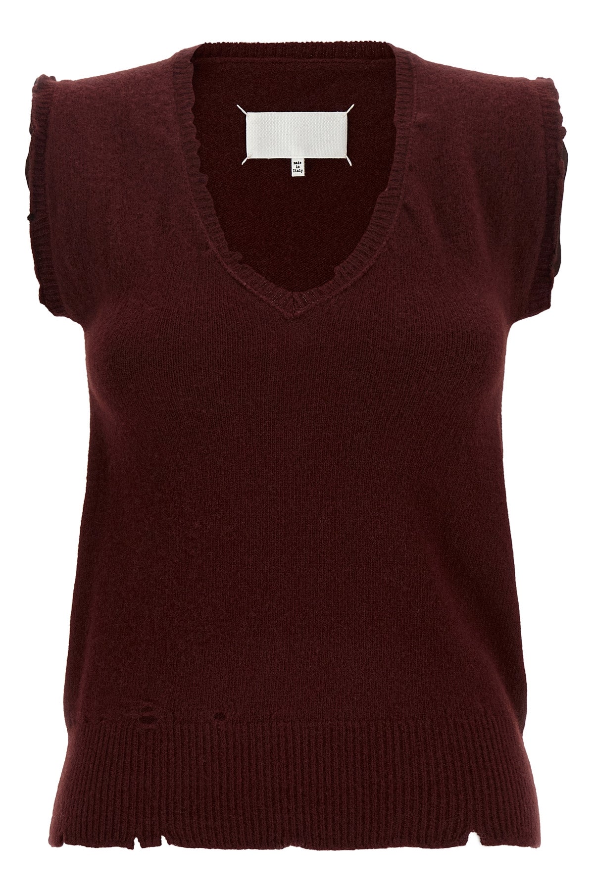 the maison margiela vest redefines the codes of knitwear through a lived and dec