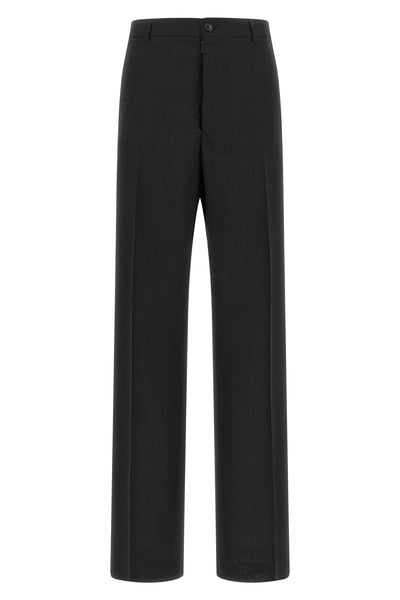 maison margiela trousers define a new sartorial proportion through a wide and st