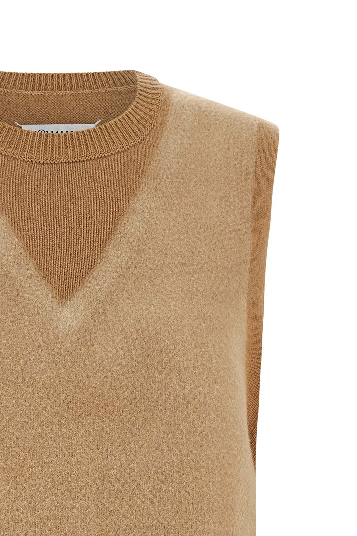 the maison margiela memory of knitted vest features a complex trompe loeil co