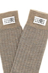 maison margiela mm6 socks redefine the essentiality of everyday wardrobe through