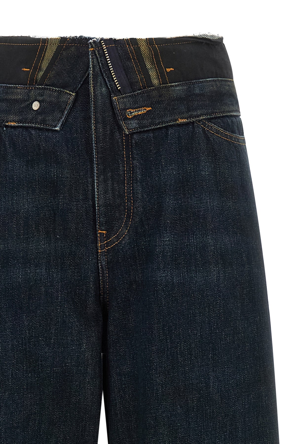 maison margiela mm6 jeans redefine the codes of dark blue denim through a decons