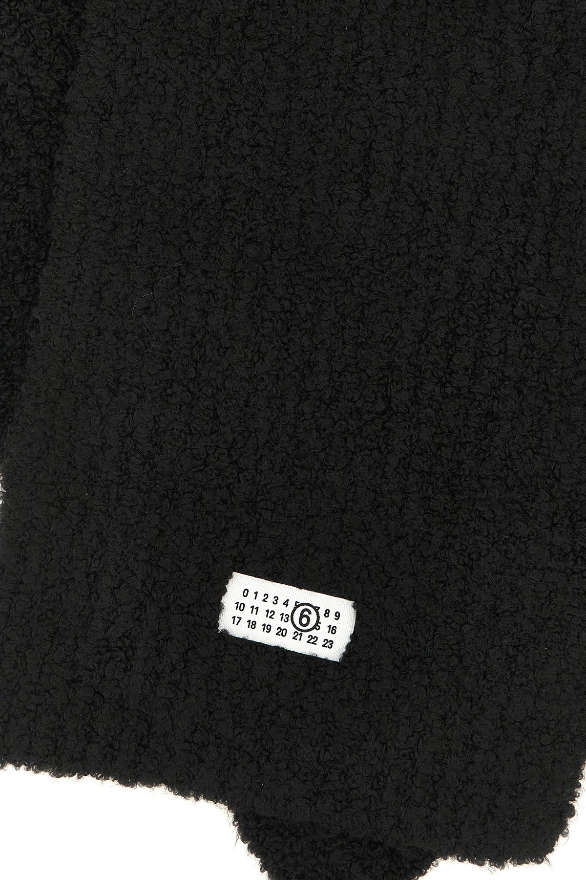 the maison margiela mm6 scarf is distinguished by an elongated rectangular const