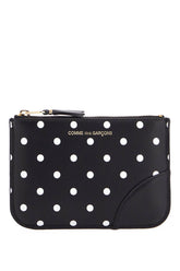 compact black polka dot wallet