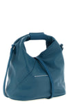 maison margielas mm6 japanese crossbody bag defines space through a rigorous
