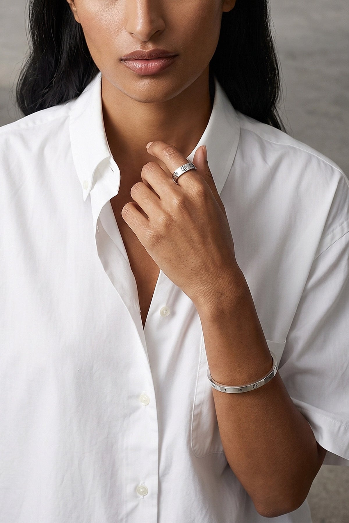 the maison margiela bangle defines the codes of industrial aesthetics through an