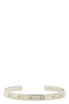 the maison margiela bangle defines the codes of industrial aesthetics through an