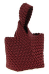 the naghedi kyoto clutch stands out for its meticulous hand-woven workmanship