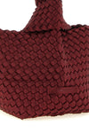 the naghedi kyoto clutch stands out for its meticulous hand-woven workmanship