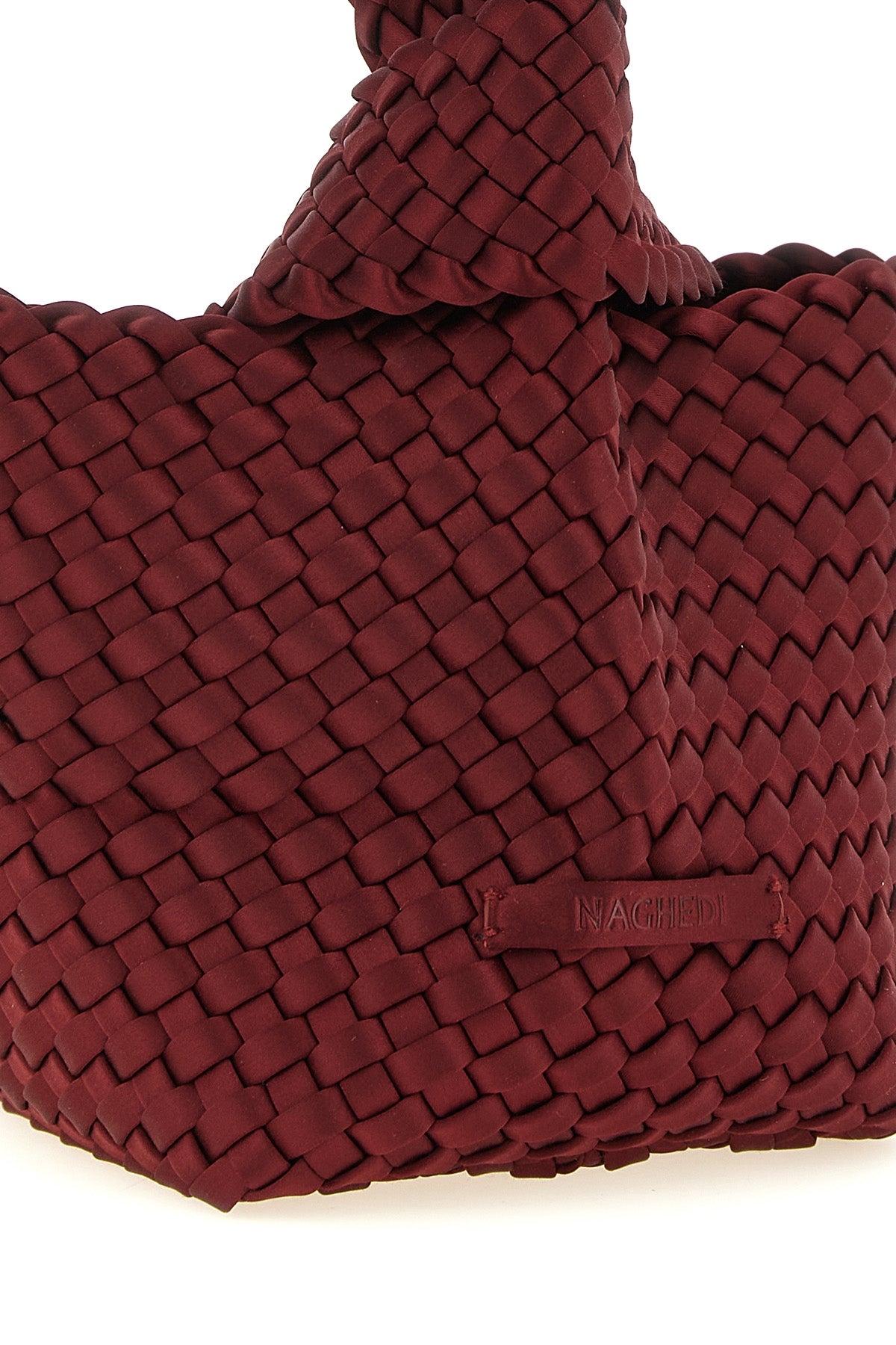 the naghedi kyoto clutch stands out for its meticulous hand-woven workmanship