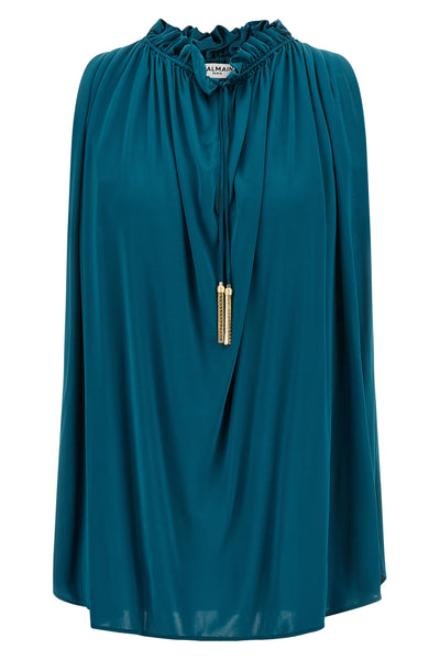 the sleeveless balmain top stands out for its fluid silhouette and impeccable ta