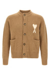 the ami paris camel cardigan redefines contemporary knitwear through relaxed vol