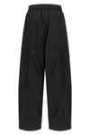 ganni multi-pocket trousers define a new urban silhouette through wide volumes a