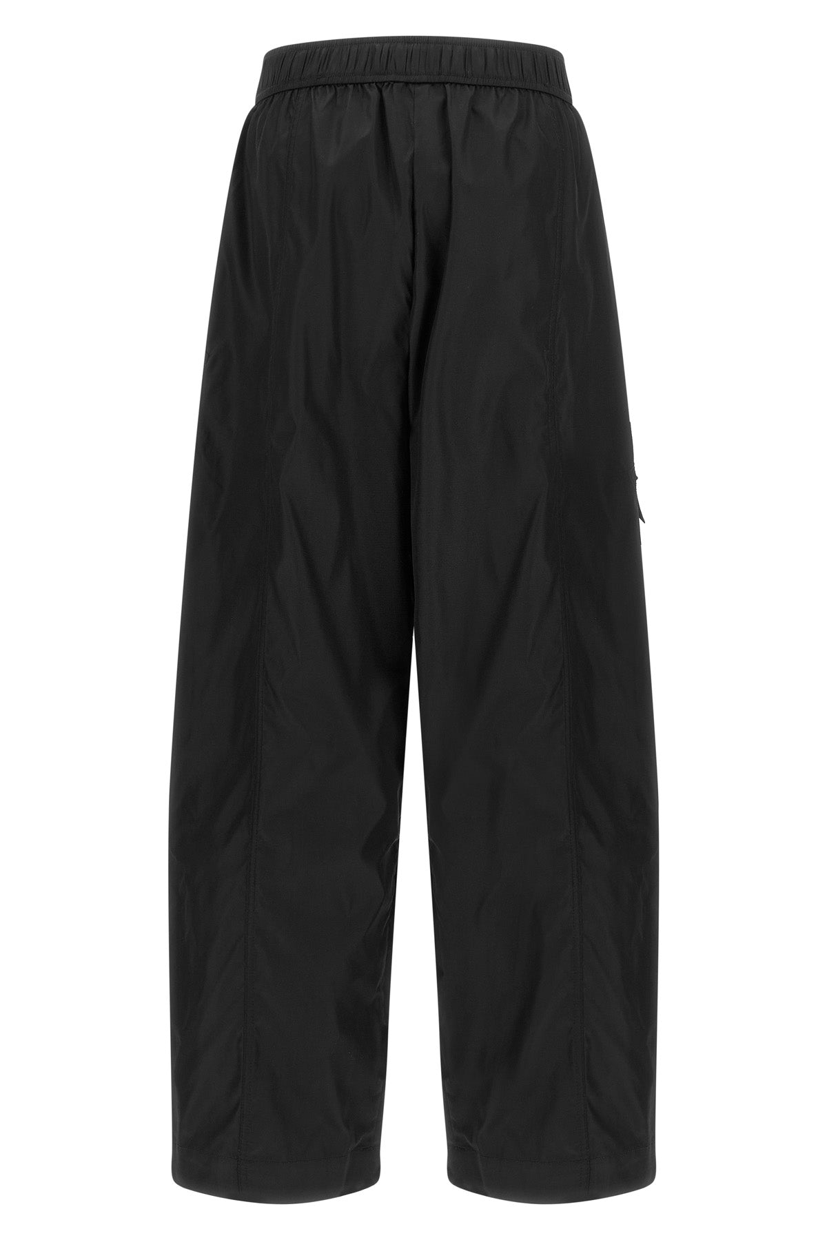 ganni multi-pocket trousers define a new urban silhouette through wide volumes a