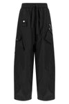 ganni multi-pocket trousers define a new urban silhouette through wide volumes a