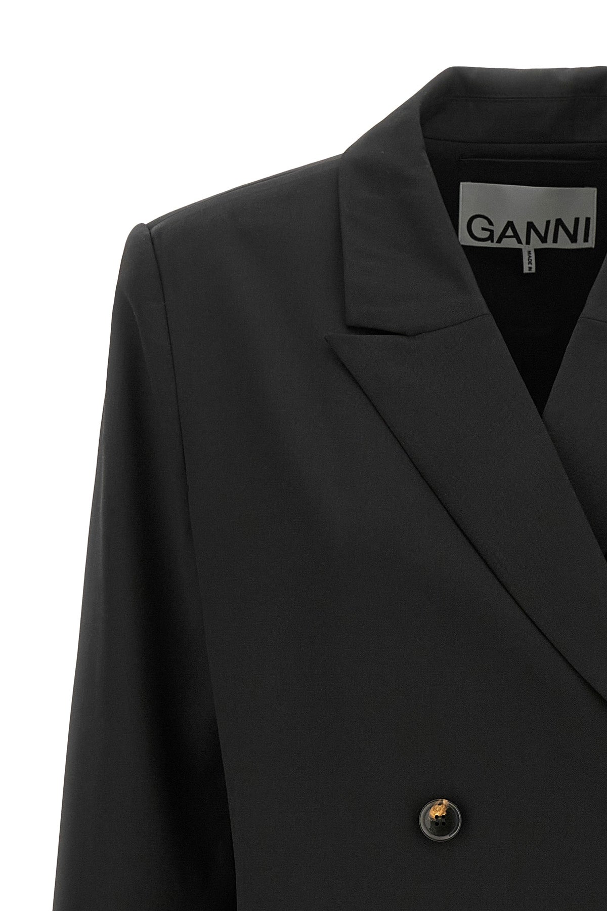 the ganni blazer redefines the codes of contemporary tailoring through a structu