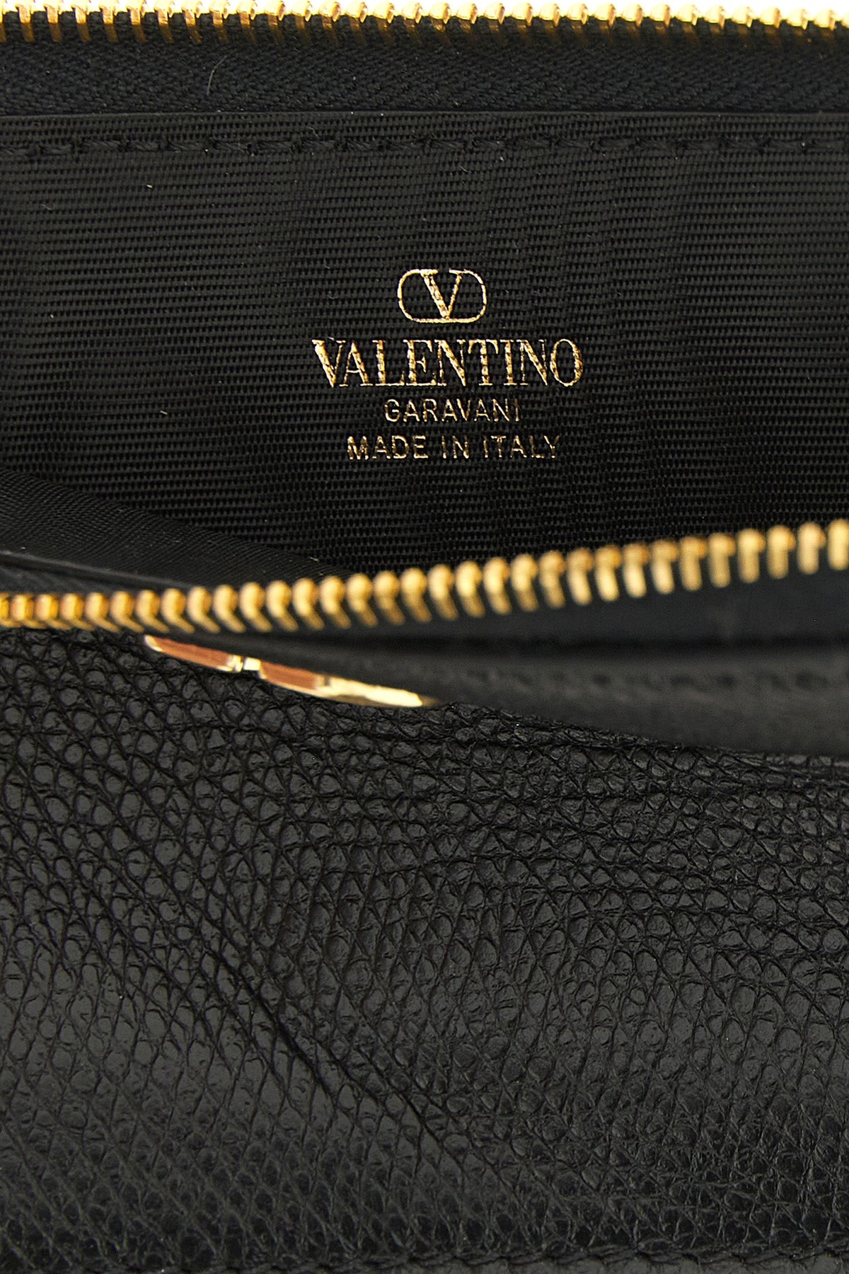 the valentino garavani coin purse and card purse represents the perfect synthesi