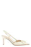 the valentino garavani slingback model pumps define a tapered silhouette through