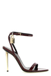 tom fords the padlock sandals define a bold silhouette through minimal constr