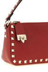 the valentino garavani small shoulder bag in red elk print calf embodies the ess