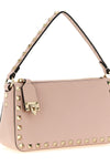 the valentino garavani rockstud small shoulder bag is made of fine grained cal